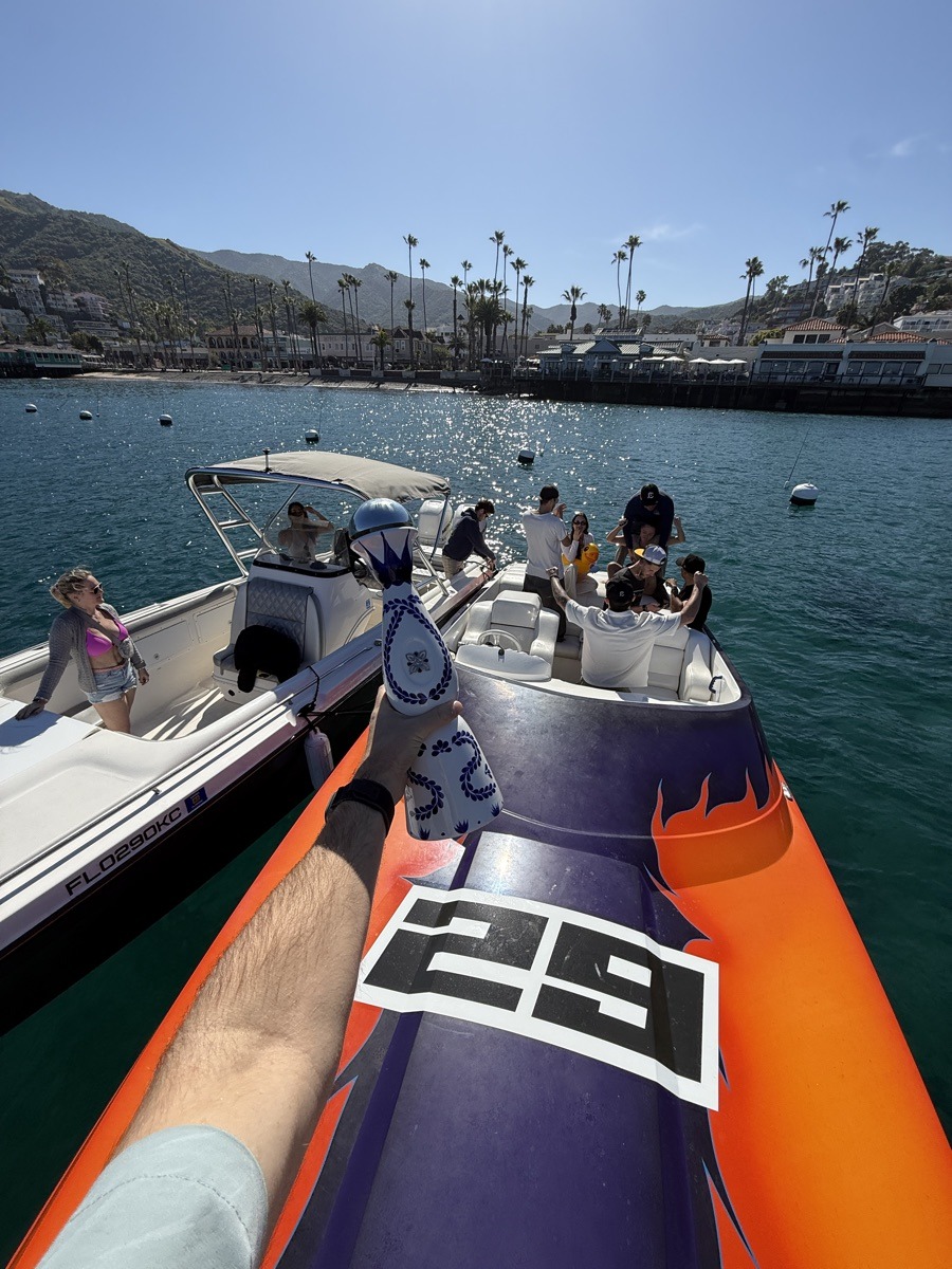Race boat pulling into the harbor at speed